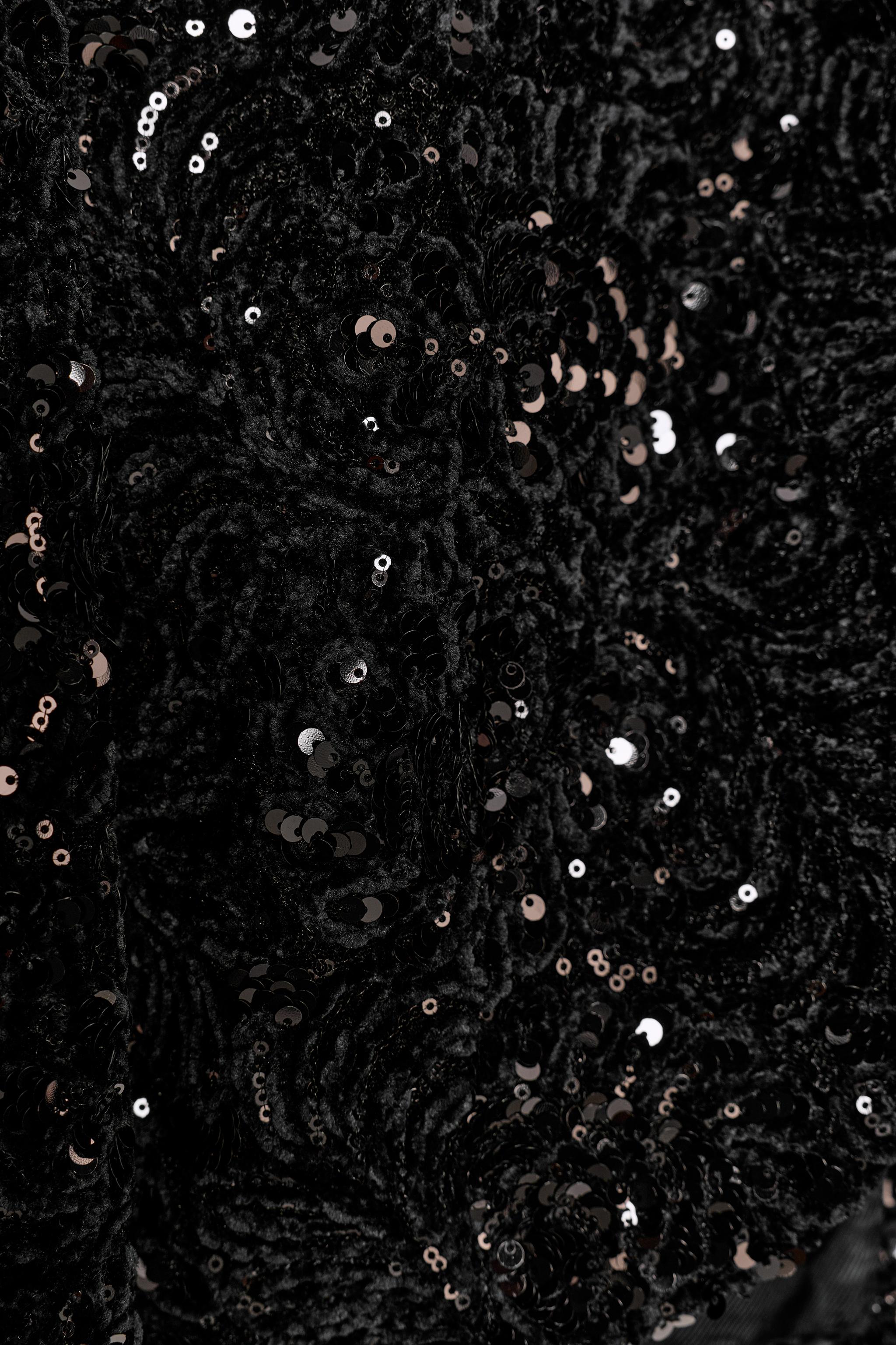 VESTE À MANCHES BOUFFANTES ET PAILLETTES